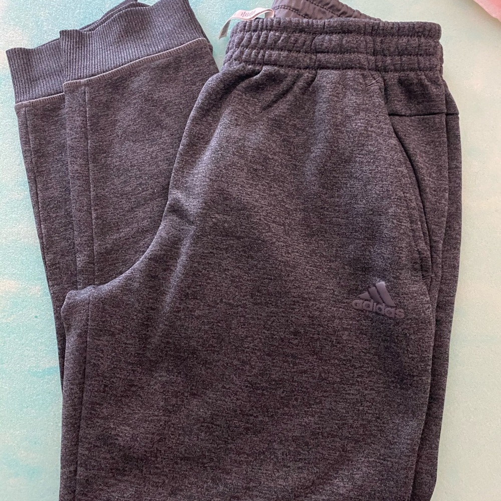 Adidas sweatpants.